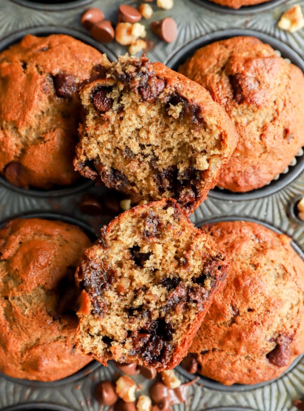 banana bread muffin cut in half with chocolate and nuts