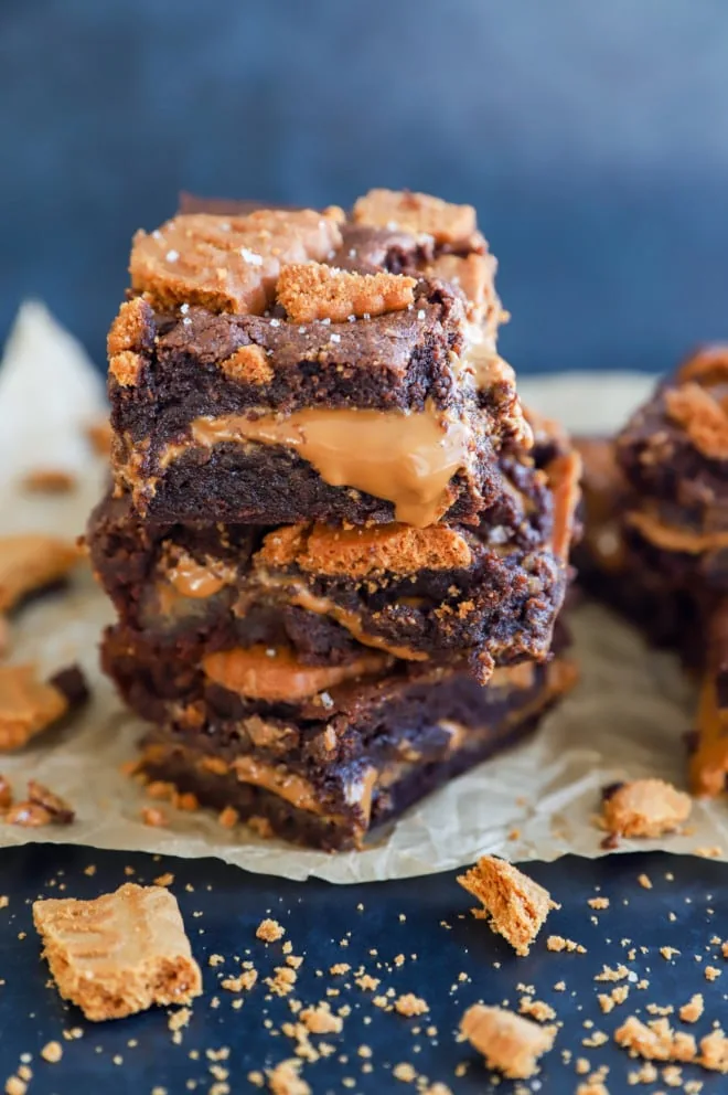 Stack of chocolate cookie butter treats on parchment paper