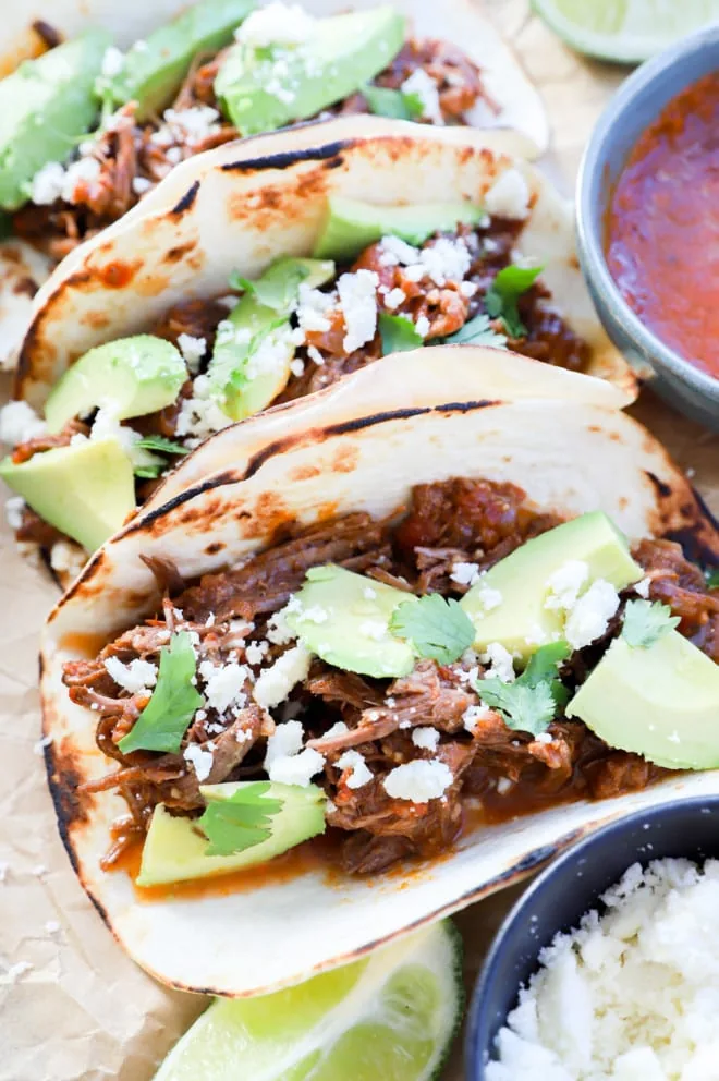 image of tortillas with meat inside and savory toppings