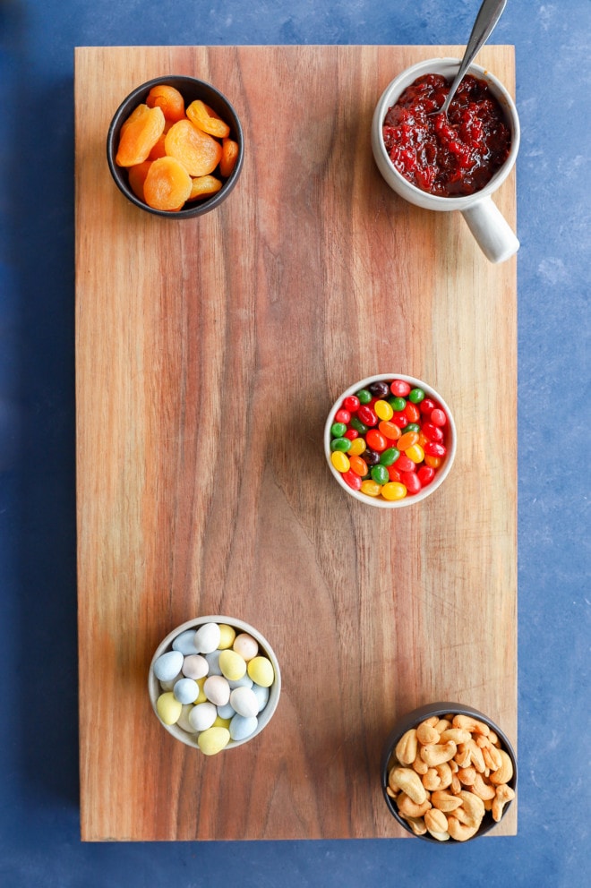 bowls added to snack platter with candy and nuts