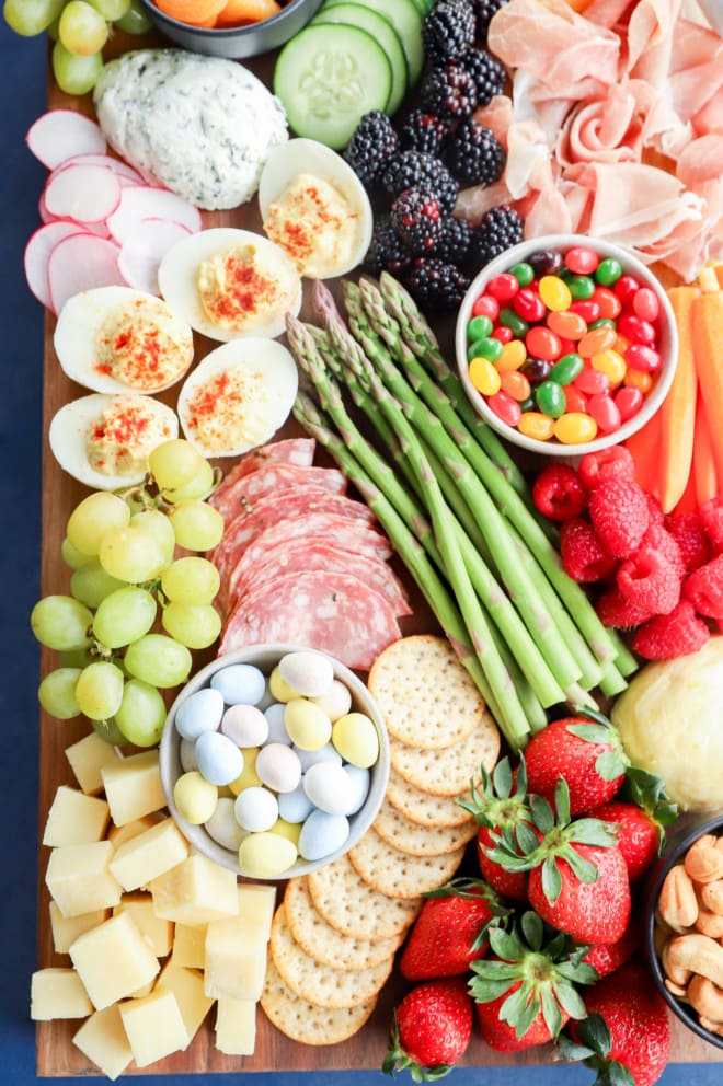 Spring-inspired charcuterie board with vegetables and fruits