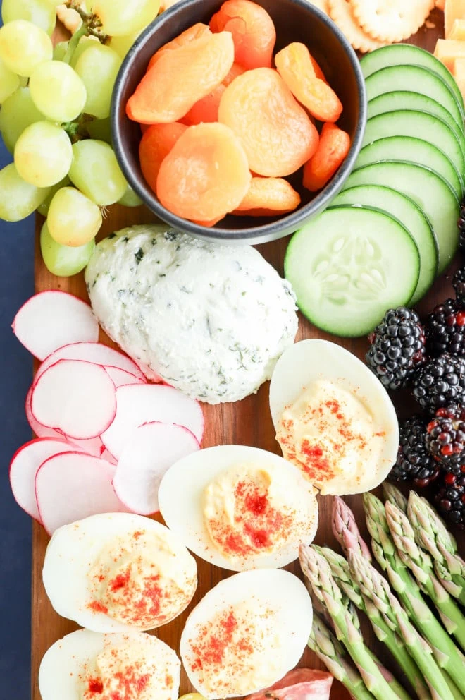 goat cheese in the shape of an egg on a snack platter