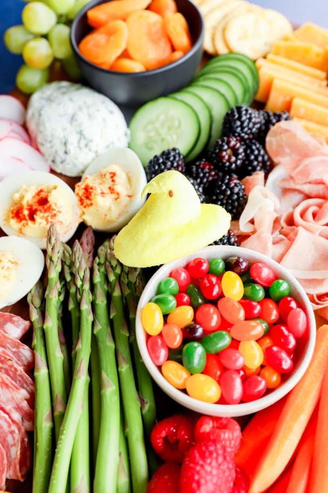 peeps and jelly beans with veggies and fruits on a snack spread