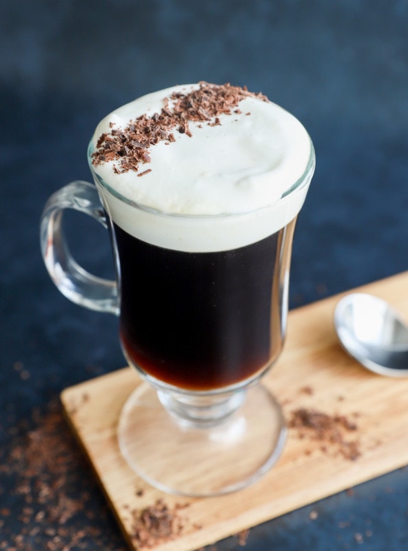 classic Irish coffee in clear mug with topping