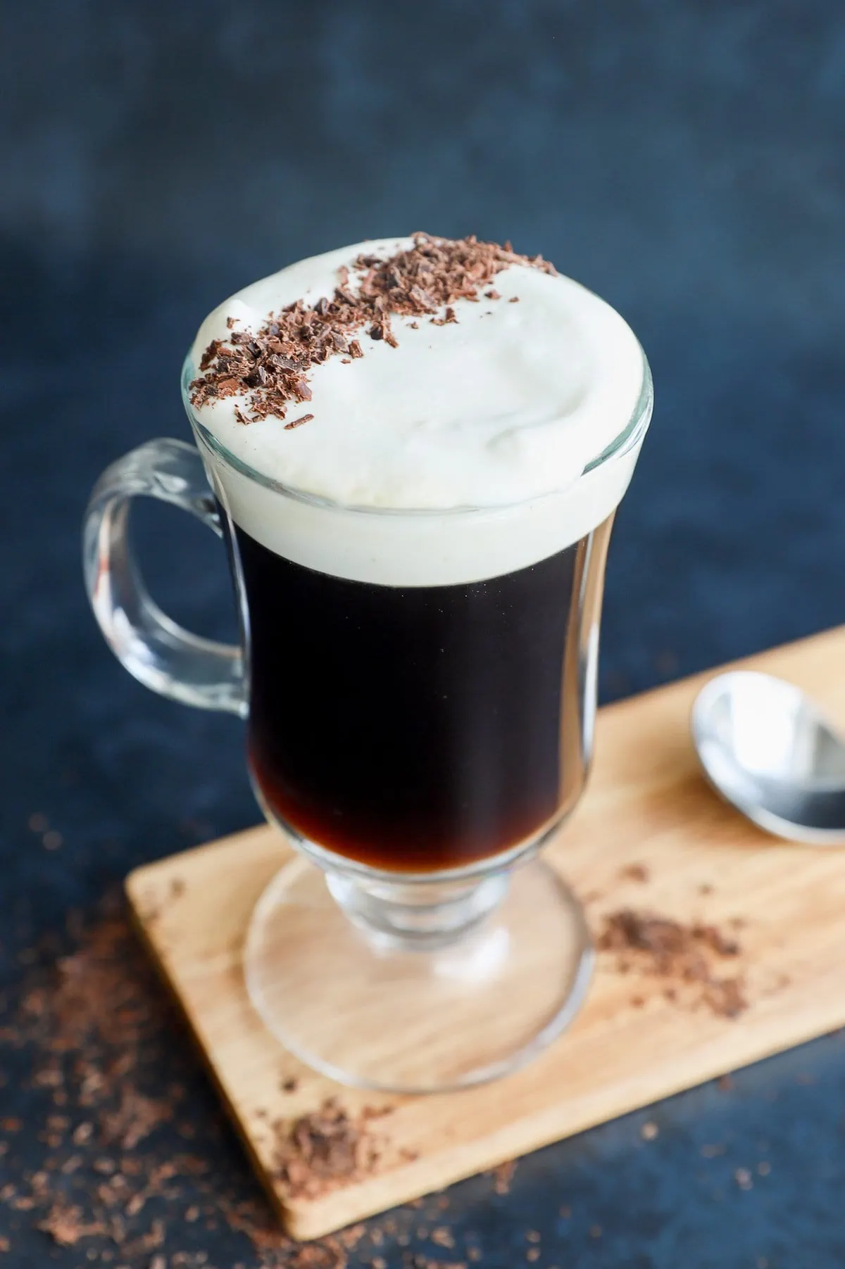 classic Irish coffee in clear mug with topping