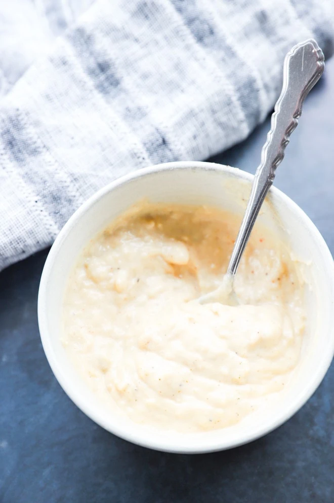 roasted garlic aioli in a bowl with a spoon