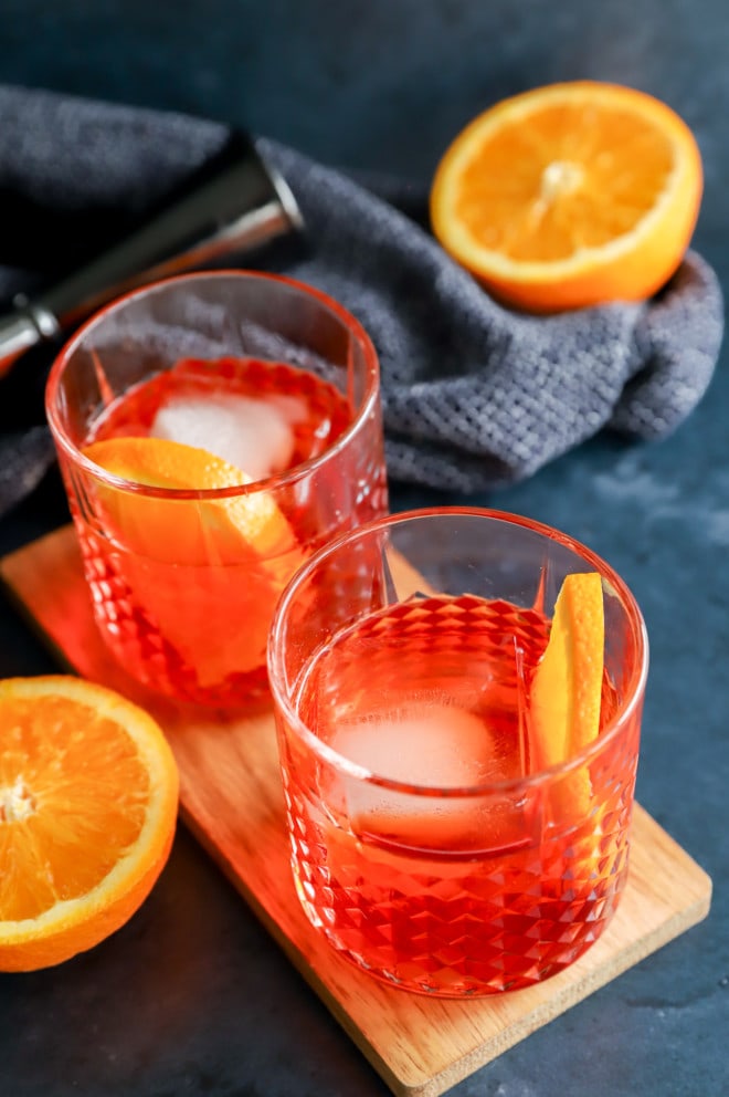 Orange halves with aperitif cocktail
