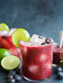 fresh berry cocktail with tequila and lime in a glass