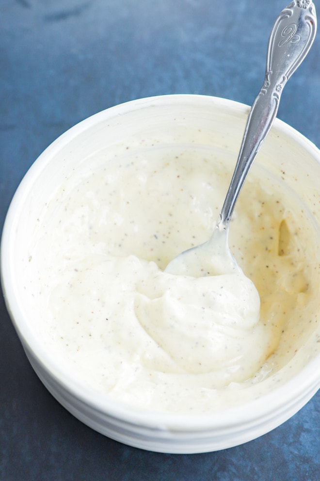 Spoon and bowl of creamy sauce to dip in