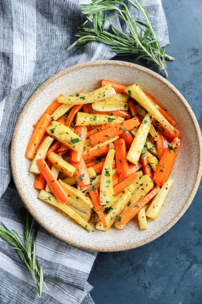 easy root vegetable side dish in bowl with fresh rosemary