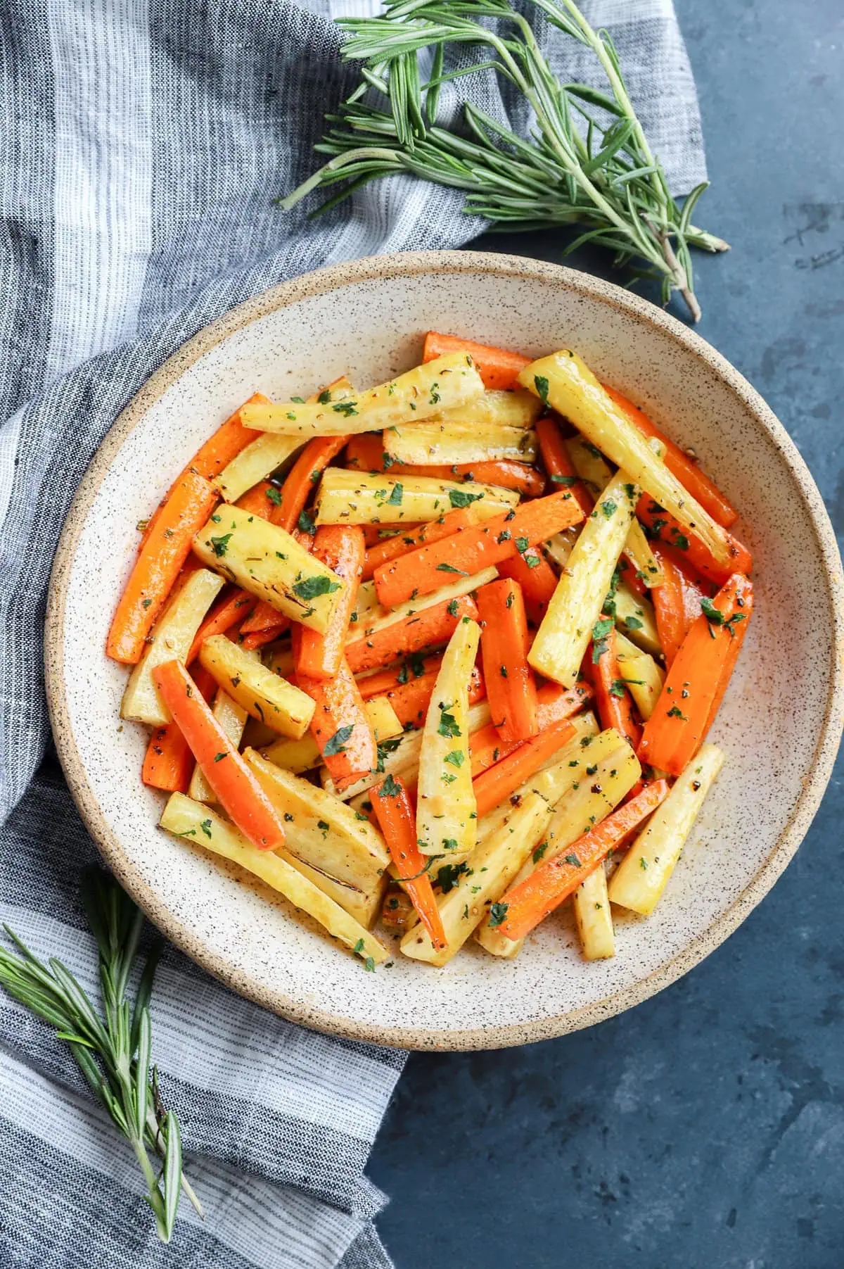 easy root vegetable side dish in bowl with fresh rosemary