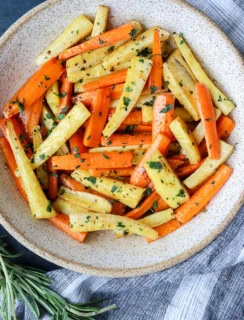 roasted vegetables in a bowl with rosemary