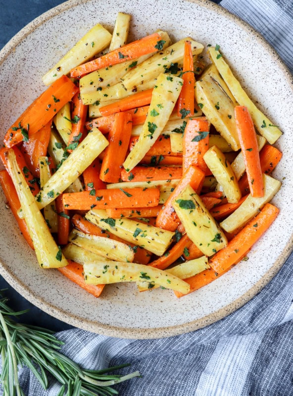 roasted vegetables in a bowl with rosemary