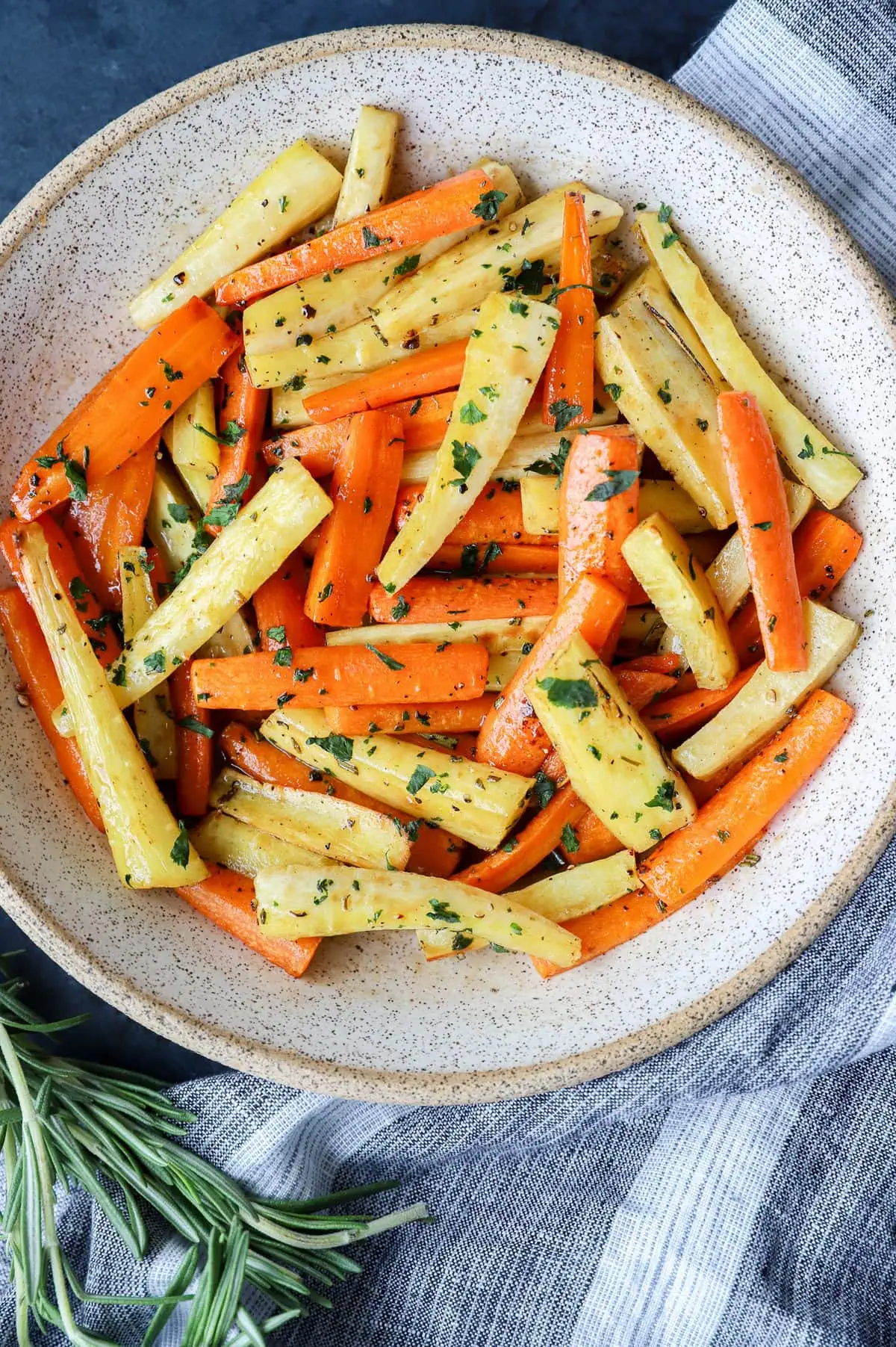 roasted vegetables in a bowl with rosemary