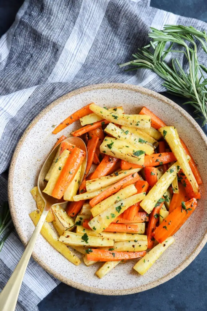 bowl of glazed roasted root vegetables with linen