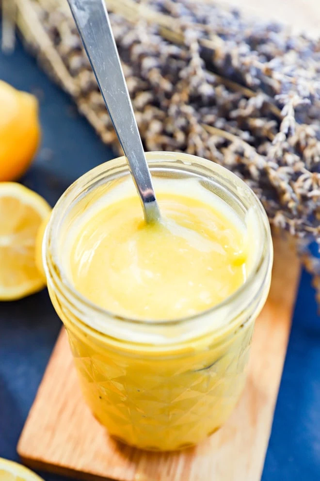 lavender lemon curd in a mason jar with a spoon