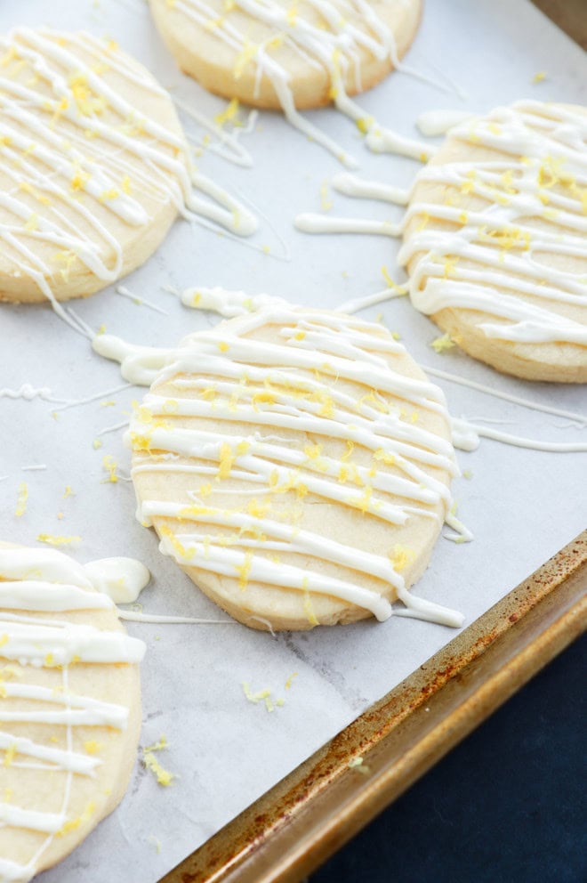 lemon shortbread cookies with white chocolate and lemon zest on top