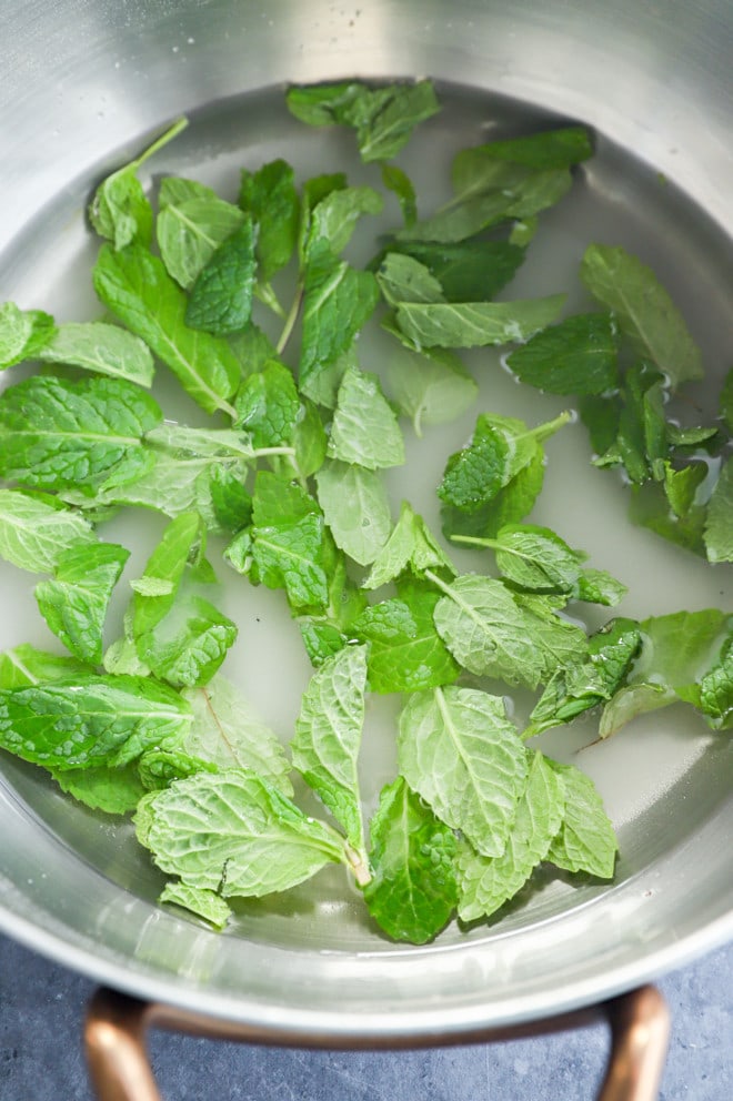making mint simple syrup in a saucepan
