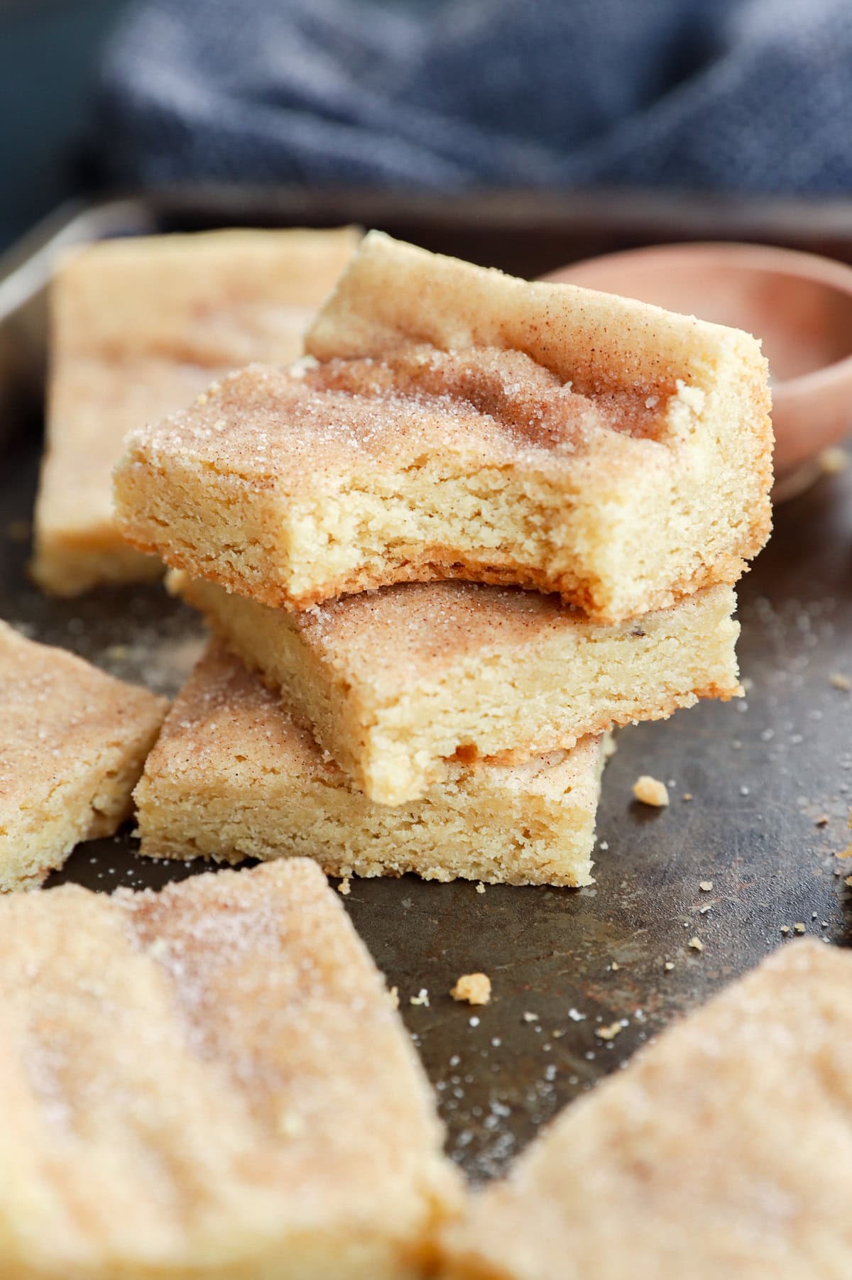 stack of cinnamon sugar cookies with bite taken out