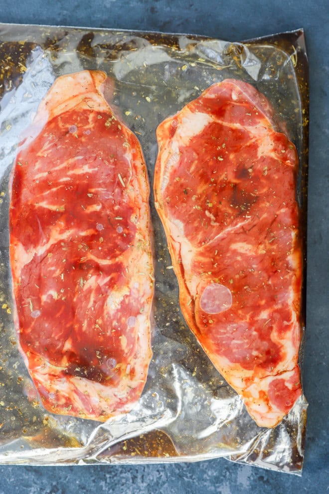 steaks marinating in a resealable bag