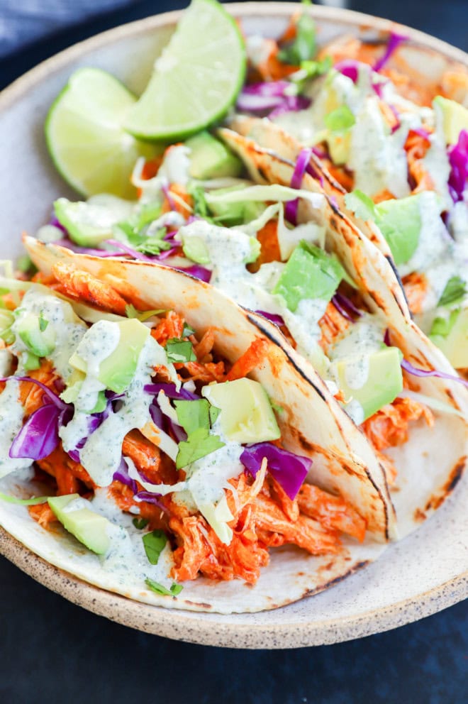 spicy tacos with limes in the bowl