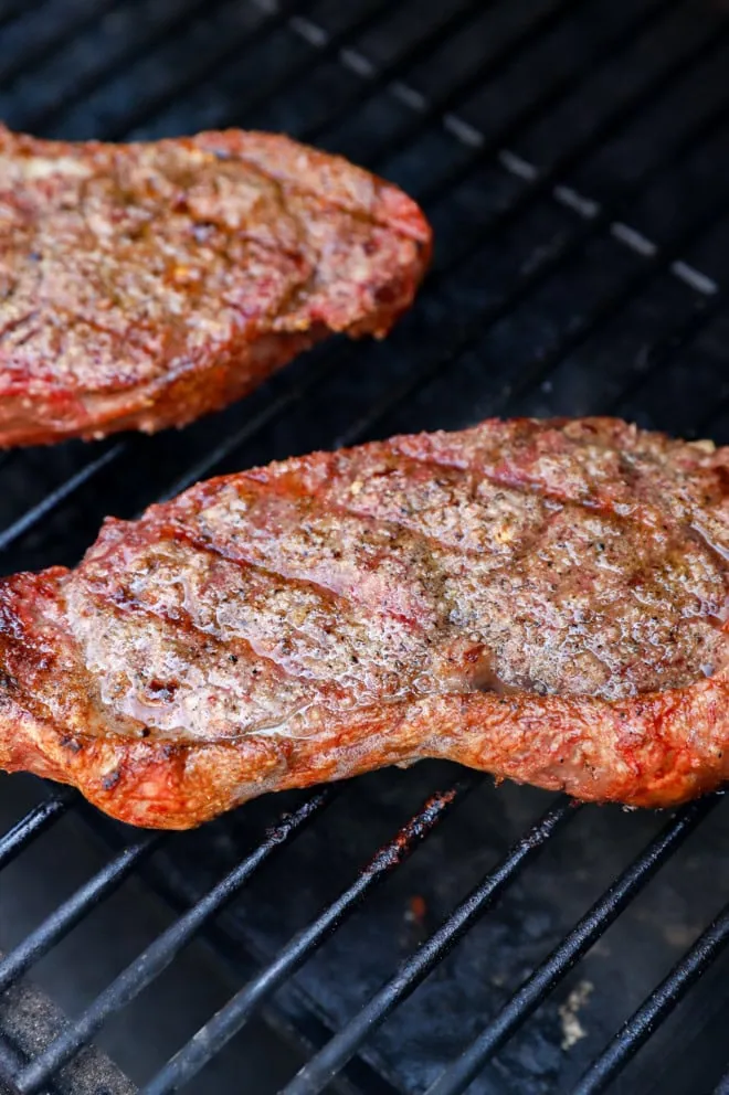 cooking cuts of beef on the grill