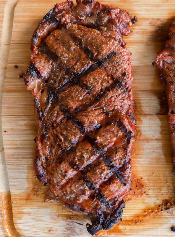 grilled cut of beef on a cutting board