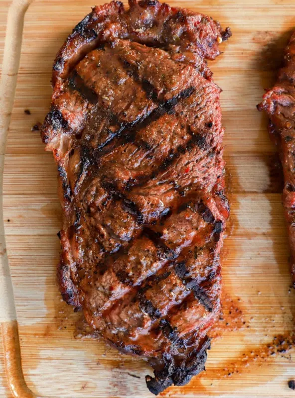 grilled cut of beef on a cutting board