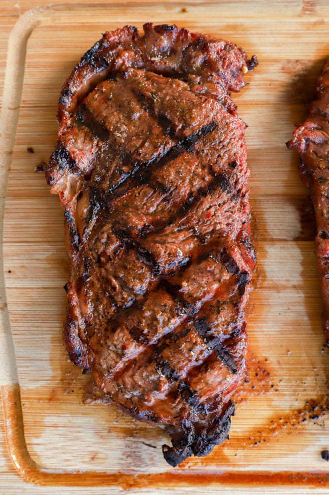 grilled cut of beef on a cutting board