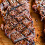 sliced cut of beef on a platter juicy and tender