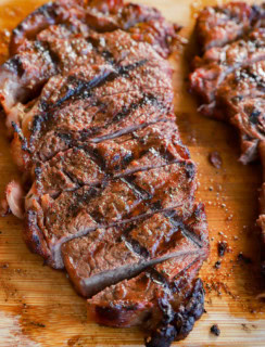 sliced cut of beef on a platter juicy and tender