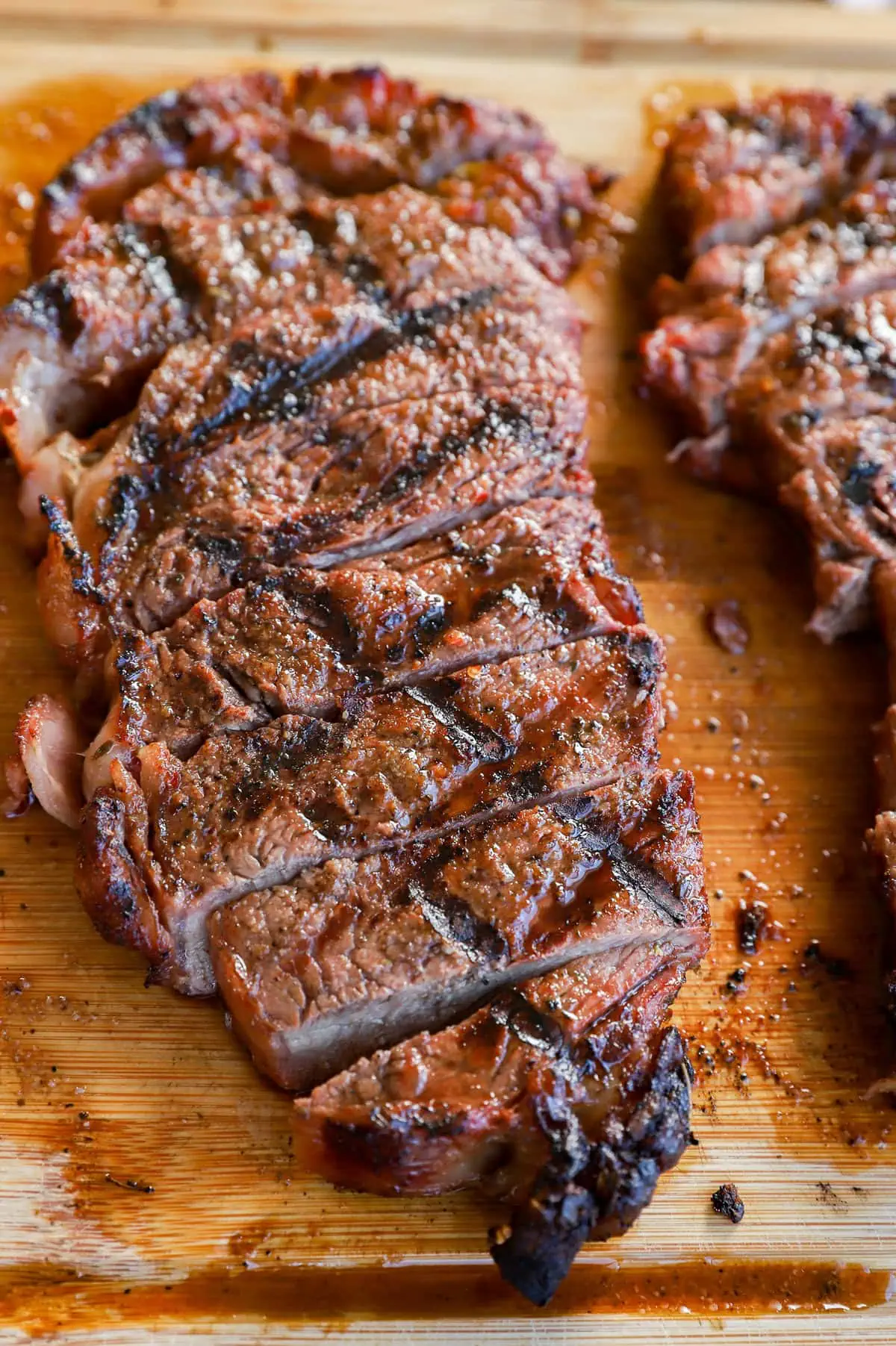 sliced cut of beef on a platter juicy and tender