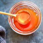spoon of hot honey from jar