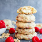 stack of baked fruity treats with fresh raspberries