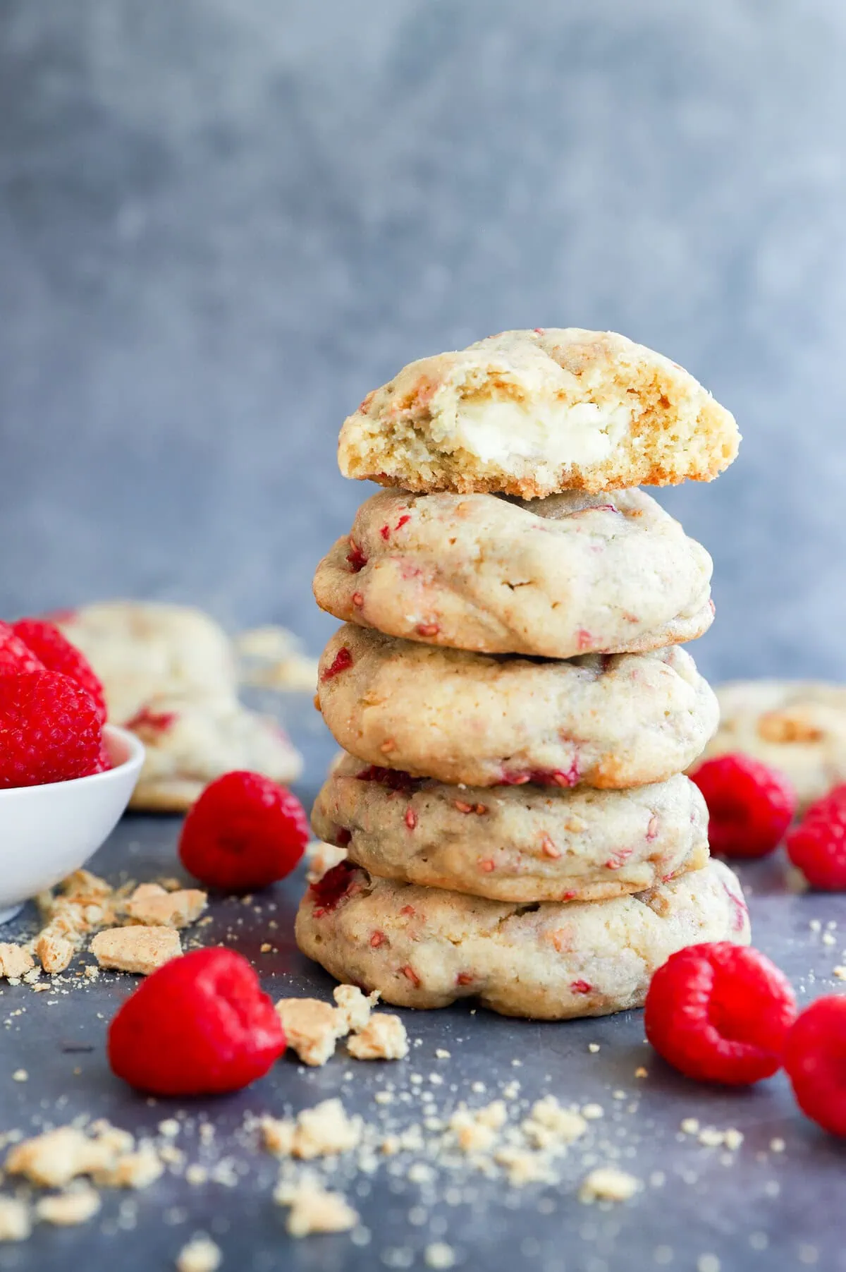 stack of baked fruity treats with fresh raspberries