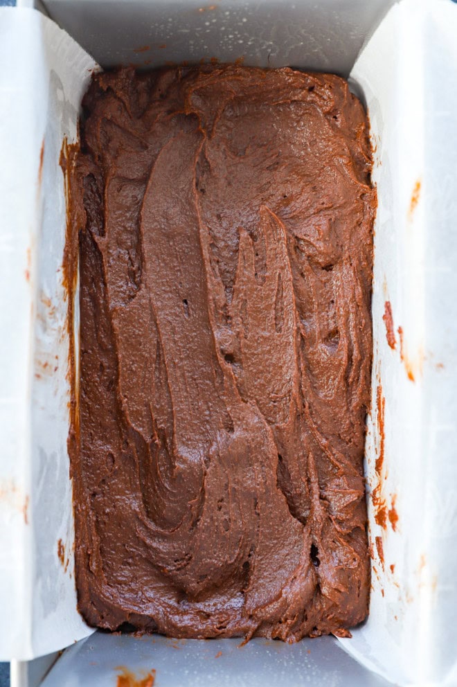 sizzling brownie batter in parchment lined pan