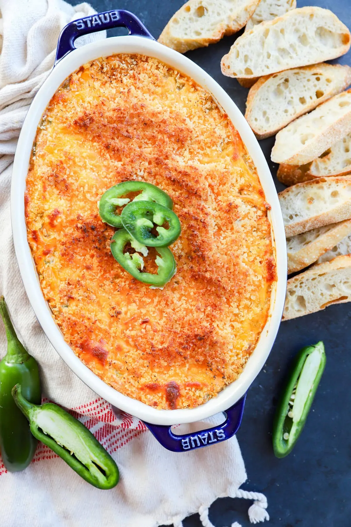 baked jalapeno popper dip with jalapeno slices on top