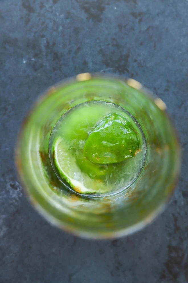Muddled lime wedges and simple syrup