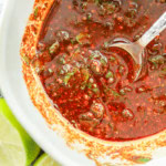 Mexican chicken marinade in a bowl with a pretty spoon