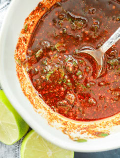 Mexican chicken marinade in a bowl with a pretty spoon
