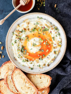 Cheesy dip with honey and toasted slices of bread
