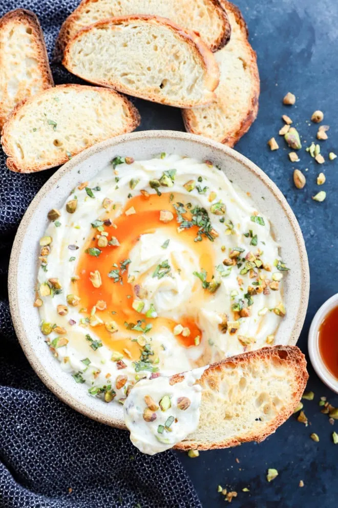 Toasted slice of bread with whipped ricotta on it