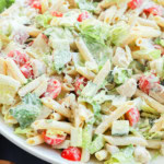 chicken caesar pasta salad in a large bowl