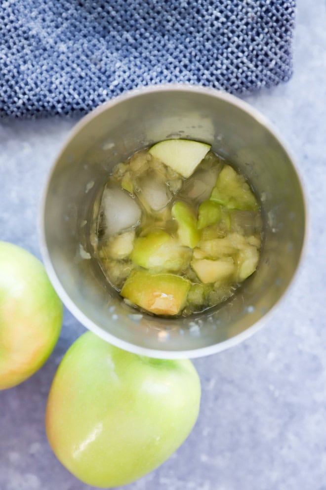 fresh apple martini in a cocktail shaker with ice
