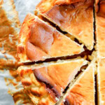 sliced san sebastian cheesecake on parchment paper