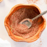 bowl of homemade chili seasoning recipe with spoon and measuring spoons