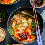 30 minute dumpling soup in bowls with chopsticks and chili crisp