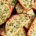easy fresh herb bread slices on a plate with butter