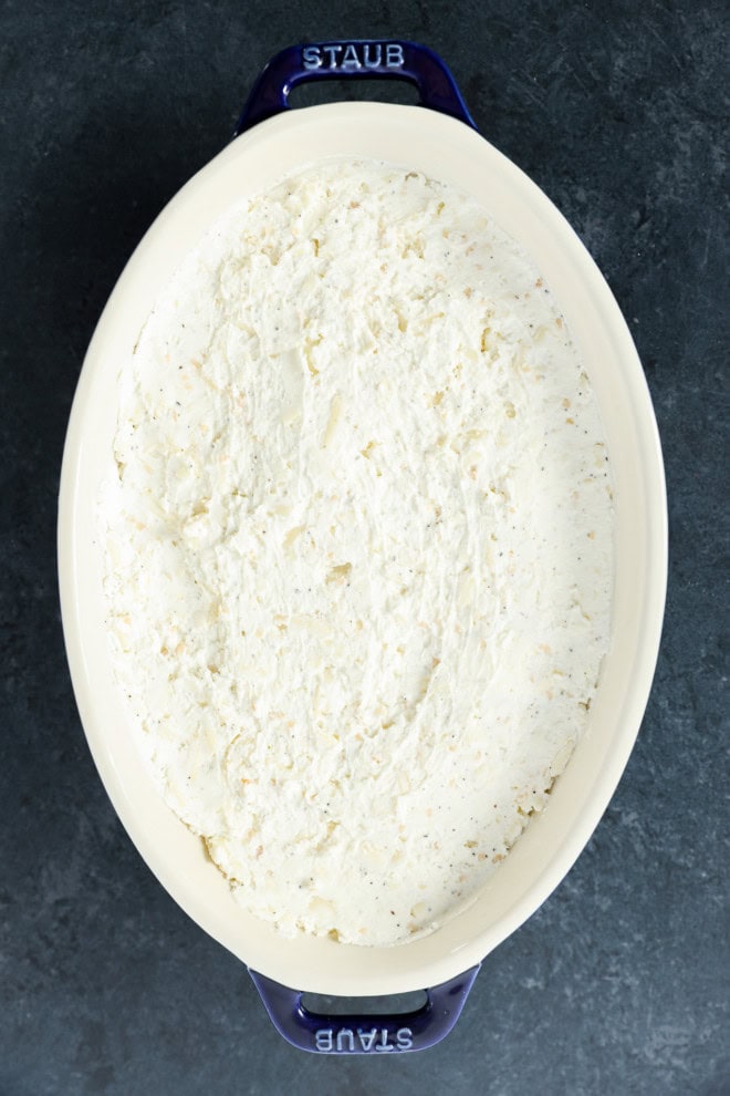 baked goat cheese appetizer in baking dish before baking