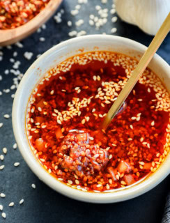 spoon in bowl of chili garlic oil recipe